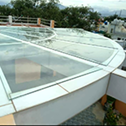 Modern glass canopy and pergola system for building entrances and outdoor spaces