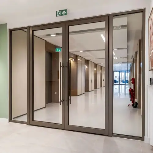 Fire rated glazed partition system providing visibility and fire protection in modern interiors