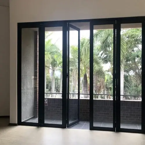 Modern aluminium system door with durable frame and glass panels for residential and commercial entrances