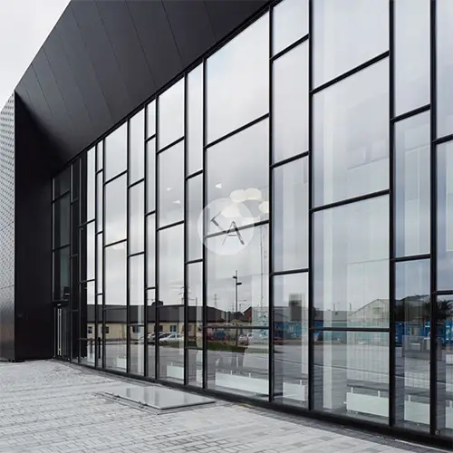 Modern curtain wall glazing system with aluminium frames and large glass facade on a commercial building
